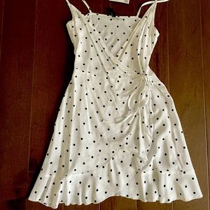 White and black polka dot mini tie flow dress